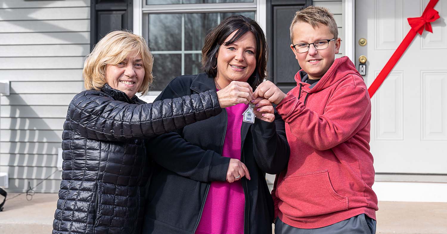 Toohey family with Zorica receiving keys