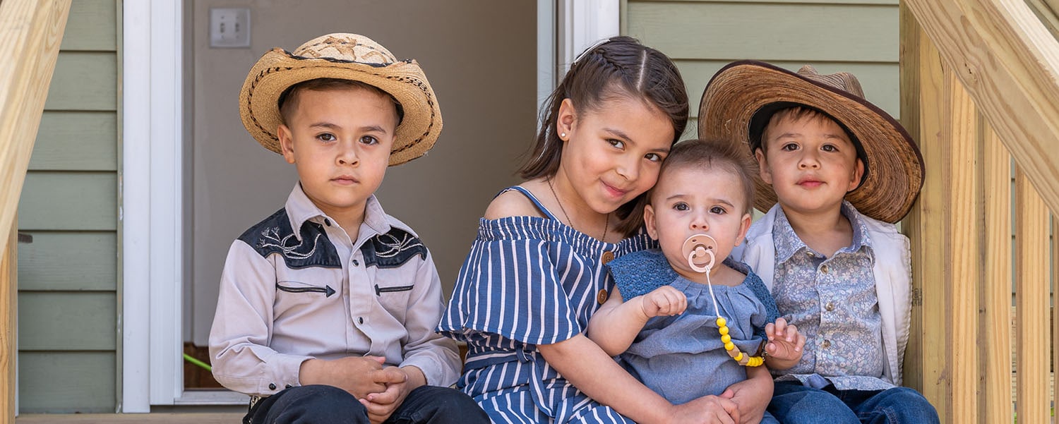 Children in front of new Habitat home