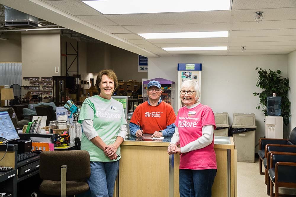 Volunteers working together at ReStore