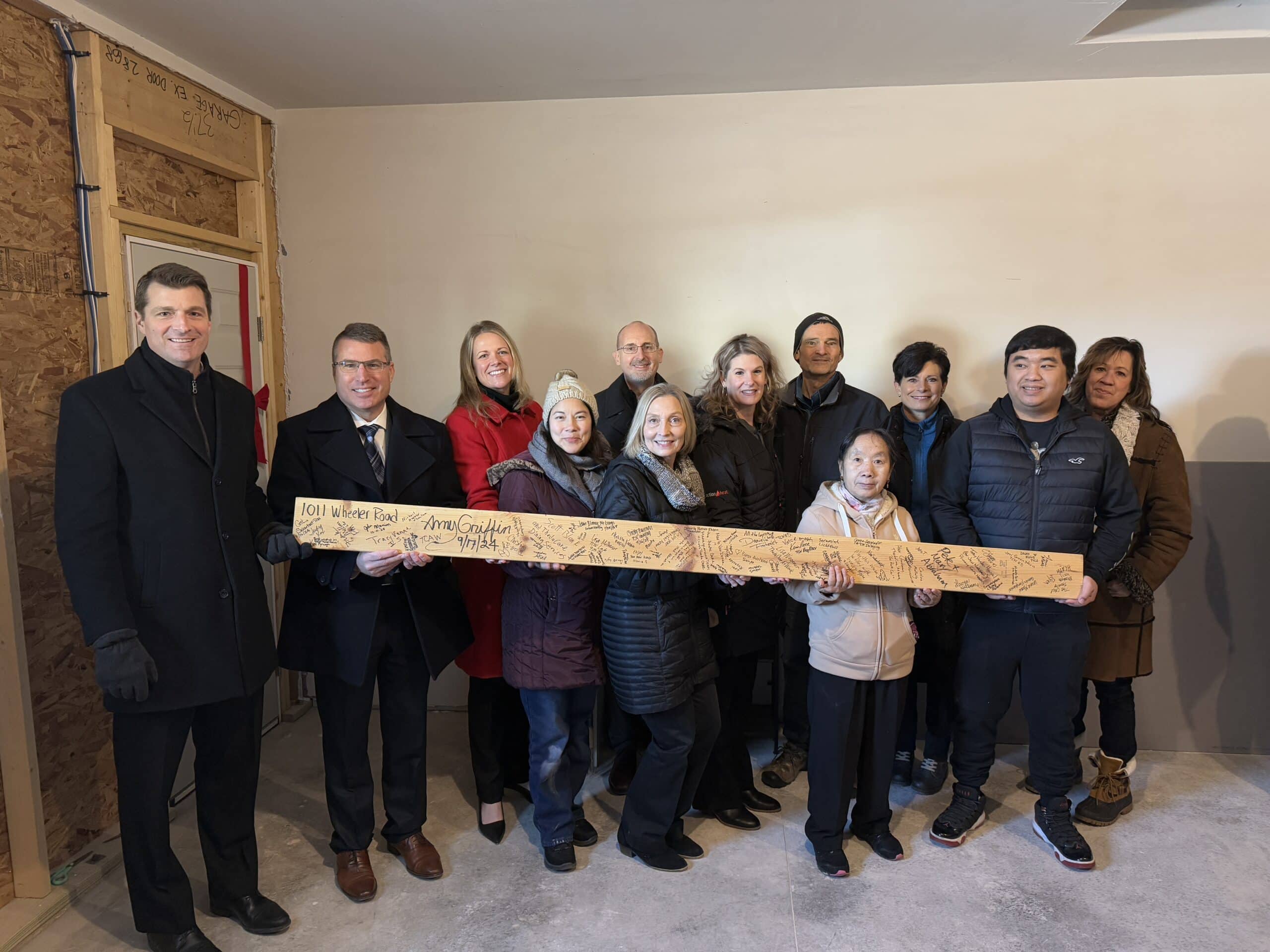 Faith groups at a beam blessing event