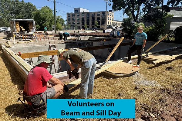 Fox Cities Habitat volunteers working on the beam and sill during construction of a new home.